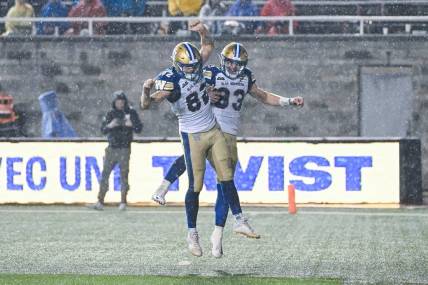 Jul 1, 2023; Montreal, Quebec, CAN; Winnipeg Blue Bombers wide receiver Dalton Schoen (83) celebrates his touchdown against the Montreal Alouettes with his teammates during the third quarter at Percival Molson Memorial Stadium. Mandatory Credit: David Kirouac-USA TODAY Sports