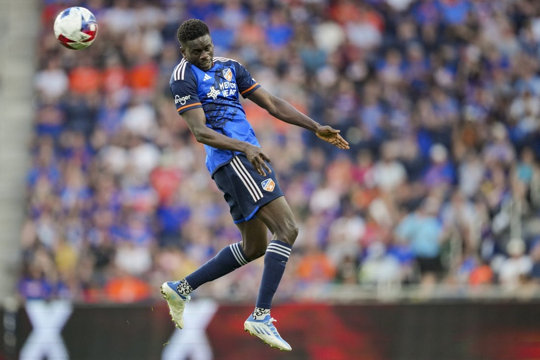 Jun 21, 2023; Cincinnati, Ohio, USA;  FC Cincinnati forward Dominique Badji (14) heads the ball against Toronto FC in the first half at TQL Stadium. Mandatory Credit: Aaron Doster-USA TODAY Sports