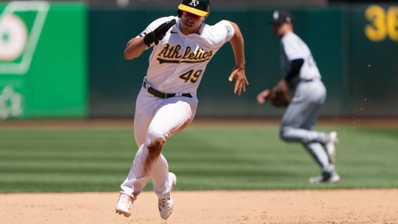 Jul 2, 2023; Oakland, California, USA;  Oakland Athletics first baseman Ryan Noda (49) runs during the fifth inning against the Chicago White Sox at Oakland-Alameda County Coliseum. Mandatory Credit: Stan Szeto-USA TODAY Sports