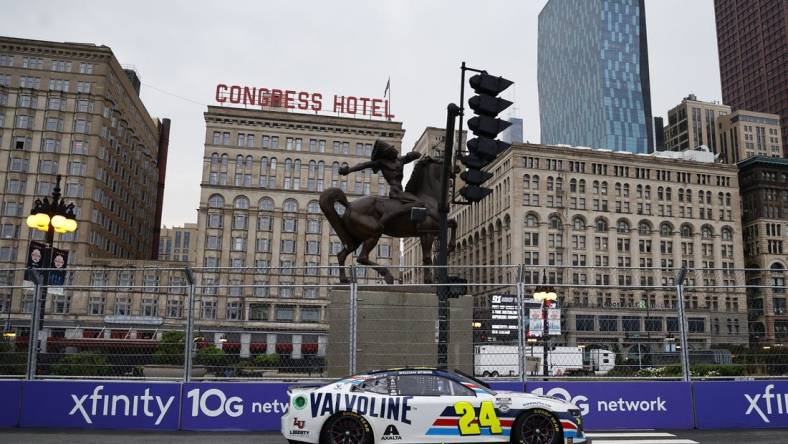 Jul 2, 2023; Chicago, Illinois, USA; NASCAR Cup Series driver William Byron (24) races along Grant Park during the Grant Park 220 of the Chicago Street Race at Chicago Street Race. Mandatory Credit: Mike Dinovo-USA TODAY Sports