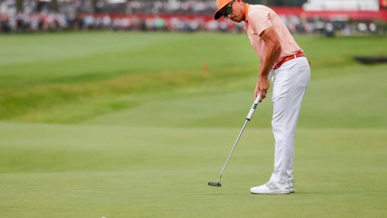 Rickie Fowler putts a birdie on the 18th hole at the first playoff round during the fourth round of Rocket Mortgage Classic at Detroit Golf Club in Detroit on Sunday, July 2, 2023.