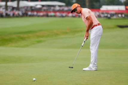 Rickie Fowler putts a birdie on the 18th hole at the first playoff round during the fourth round of Rocket Mortgage Classic at Detroit Golf Club in Detroit on Sunday, July 2, 2023.