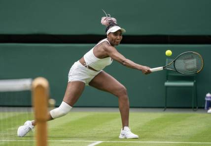 Jul 3, 2023; London, United Kingdom; Elina Svitolina (UKR) returns the ball against Venus Williams (USA) at the All England Lawn Tennis and Croquet Club. Mandatory Credit: Susan Mullane-USA TODAY Sports
