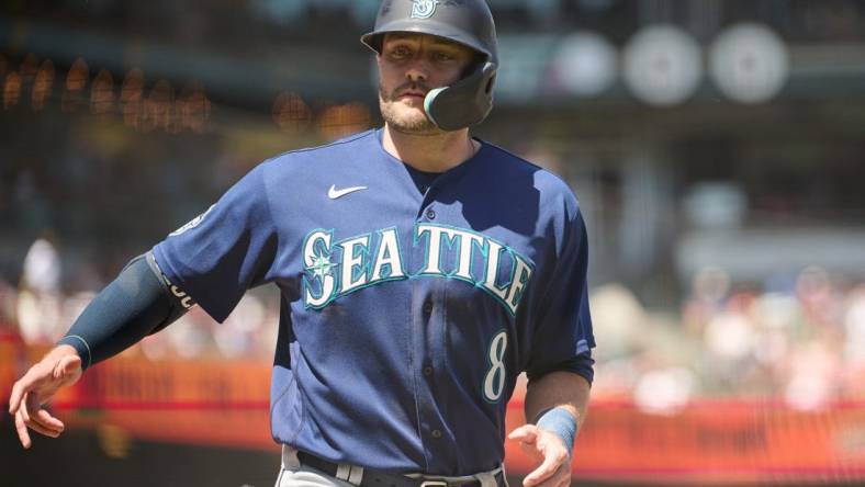 Jul 4, 2023; San Francisco, California, USA; Seattle Mariners designated hitter AJ Pollock (8) scores a run against the San Francisco Giants during the sixth inning at Oracle Park. Mandatory Credit: Robert Edwards-USA TODAY Sports