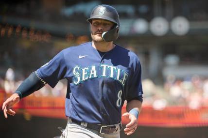 Jul 4, 2023; San Francisco, California, USA; Seattle Mariners designated hitter AJ Pollock (8) scores a run against the San Francisco Giants during the sixth inning at Oracle Park. Mandatory Credit: Robert Edwards-USA TODAY Sports