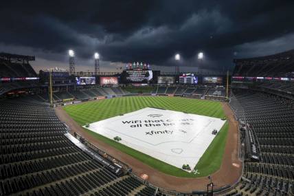 Jul 5, 2023; Chicago, Illinois, USA; A tarp covers the infield during a rain delay before a game between the Chicago White Sox and Toronto Blue Jays at Guaranteed Rate Field. Mandatory Credit: Kamil Krzaczynski-USA TODAY Sports