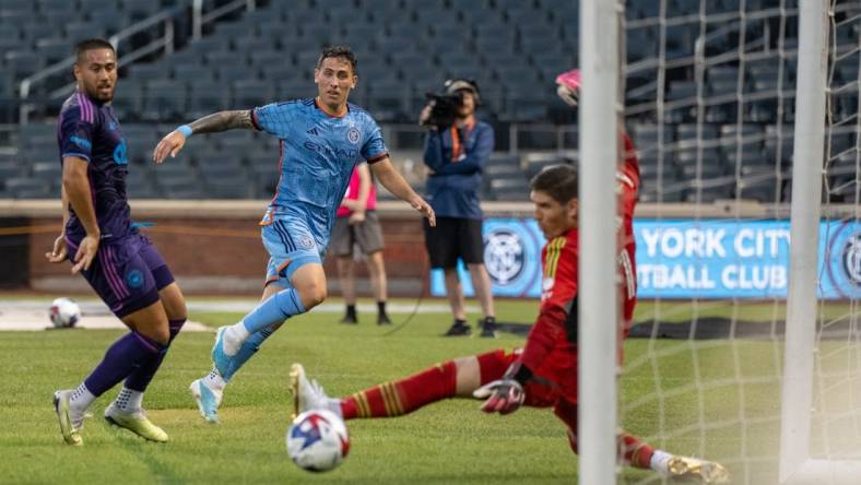 Jul 5, 2023; Queens, New York, USA; Charlotte FC goalkeeper Kristijan Kahlina (1) saves a shot by New York City FC defender Braian Cufre (3)  during the first half  at Citi Field. Mandatory Credit: Mark Smith-USA TODAY Sports