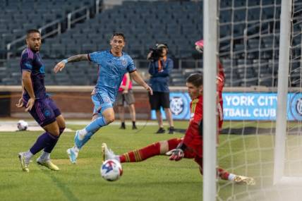 Jul 5, 2023; Queens, New York, USA; Charlotte FC goalkeeper Kristijan Kahlina (1) saves a shot by New York City FC defender Braian Cufre (3)  during the first half  at Citi Field. Mandatory Credit: Mark Smith-USA TODAY Sports