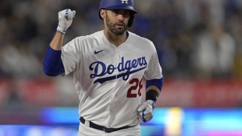 Jul 5, 2023; Los Angeles, California, USA; Los Angeles Dodgers designated hitter J.D. Martinez (28) pumps his fist as he rounds the bases after hitting a three-run home run in the fifth inning against the Pittsburgh Pirates at Dodger Stadium. Mandatory Credit: Jayne Kamin-Oncea-USA TODAY Sports