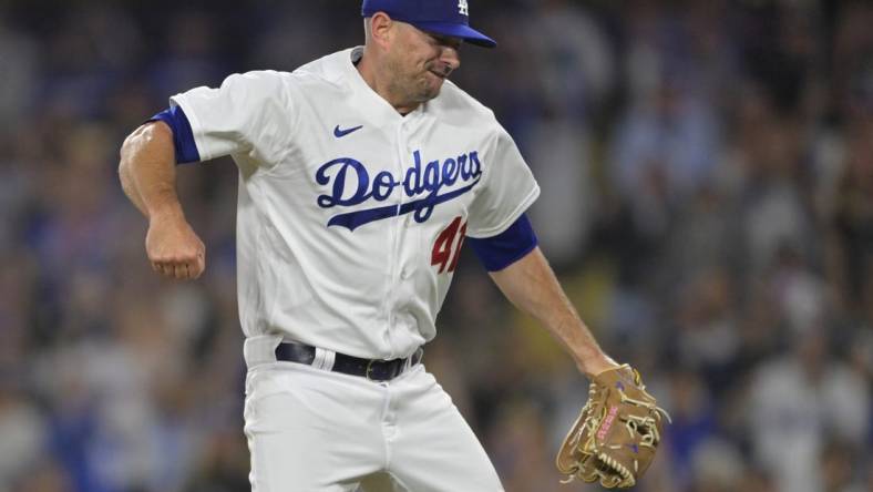 Jul 5, 2023; Los Angeles, California, USA; Los Angeles Dodgers relief pitcher Daniel Hudson (41) reacts after earning his first save of the season in the ninth inning against the Pittsburgh Pirates at Dodger Stadium. Mandatory Credit: Jayne Kamin-Oncea-USA TODAY Sports