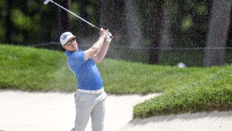 Jul 6, 2023; Silvis, Illinois, USA;  Jonas Blixt hits a shot out of a fairway bunker on the 18th hole during the first round of the John Deere Classic golf tournament. Mandatory Credit: Marc Lebryk-USA TODAY Sports