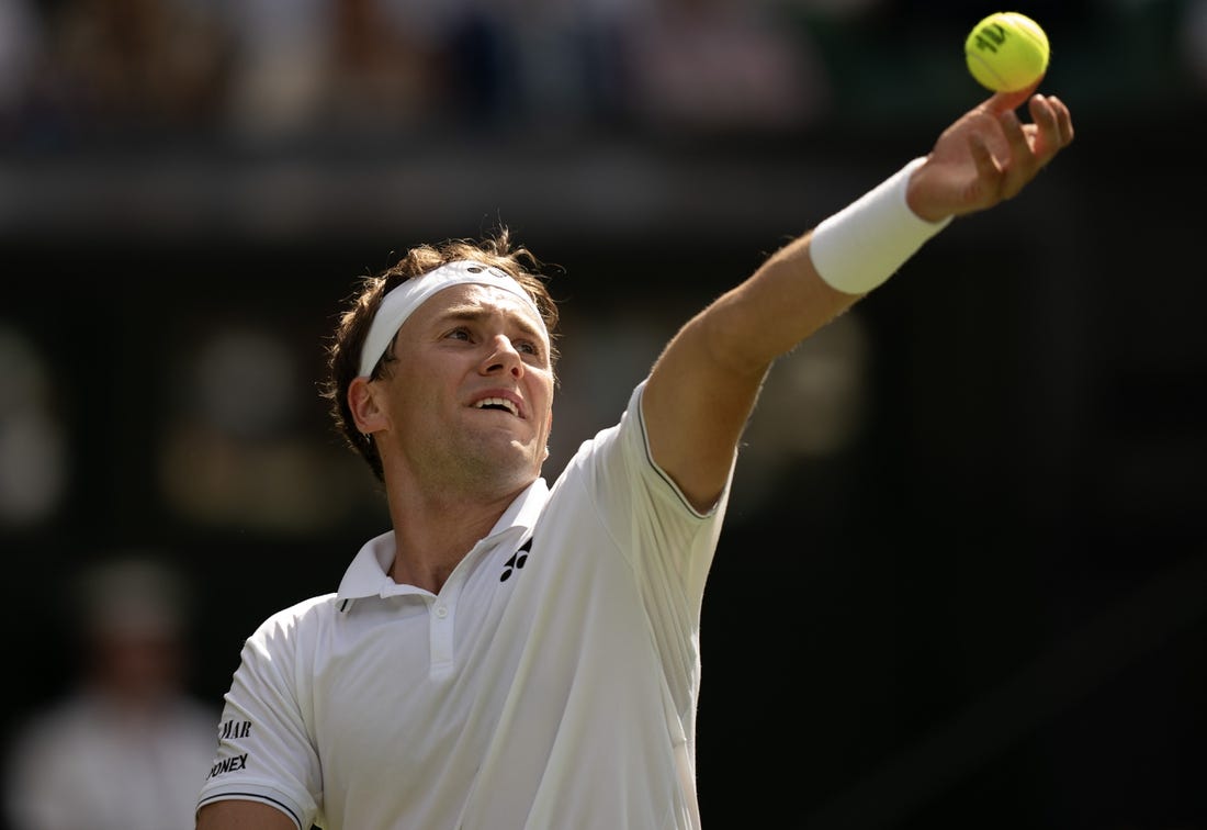 Jul 6, 2023; London, United Kingdom; Casper Ruud (NOR) tosses the ball to serve during his match against Liam Broady (GBR) on day four at the All England Lawn Tennis and Croquet Club.  Mandatory Credit: Susan Mullane-USA TODAY Sports