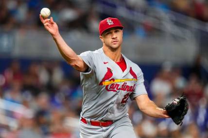Jul 6, 2023; Miami, Florida, USA; St. Louis Cardinals starting pitcher Jack Flaherty (22) throws the ball to first base against the Miami Marlins during the seventh inning at loanDepot Park. Mandatory Credit: Rich Storry-USA TODAY Sports