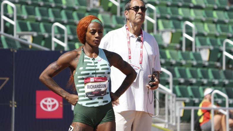 Jul 6, 2023; Eugene, OR, USA; Ventura County deputy attorney general David Glassman stands behind Sha'Carri Richardson during a women's 100m heat at the USATF Championships at Hayward Field. Mandatory Credit: Kirby Lee-USA TODAY Sports