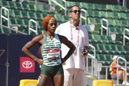 Jul 6, 2023; Eugene, OR, USA; Ventura County deputy attorney general David Glassman stands behind Sha'Carri Richardson during a women's 100m heat at the USATF Championships at Hayward Field. Mandatory Credit: Kirby Lee-USA TODAY Sports