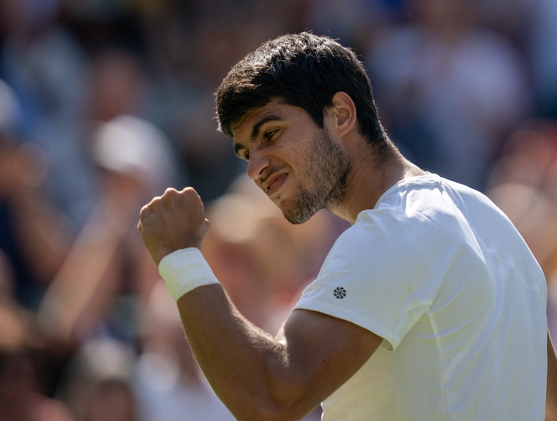 Jul 7, 2023; London, United Kingdom; Carlos Alcaraz (ESP) celebrates winning his match against Alexandre Muller (FRA) on day five of Wimbledon at the All England Lawn Tennis and Croquet Club.  Mandatory Credit: Susan Mullane-USA TODAY Sports