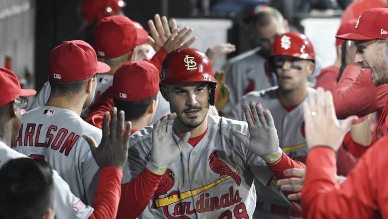 Jul 7, 2023; Chicago, Illinois, USA; St. Louis Cardinals third baseman Nolan Arenado (28) celebrates in the dugout after he hits a two run home run against the Chicago White Sox during the seventh inning at Guaranteed Rate Field. Mandatory Credit: Matt Marton-USA TODAY Sports