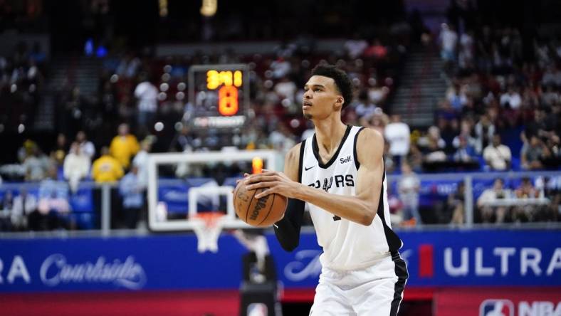 Jul 7, 2023; Las Vegas, NV, USA; San Antonio Spurs forward Victor Wembanyama (1) shoots the ball against the Charlotte Hornets during the second half at Thomas & Mack Center. Mandatory Credit: Lucas Peltier-USA TODAY Sports