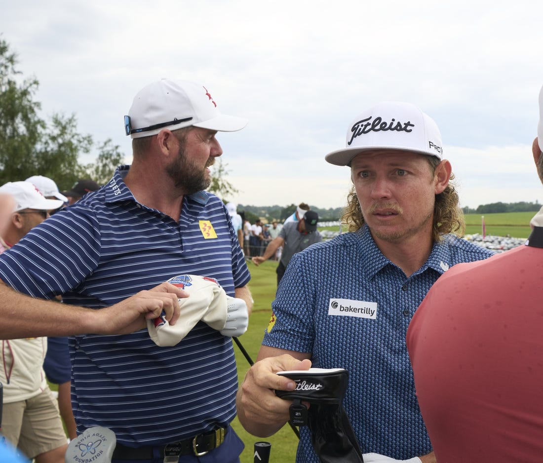 Jul 8, 2023; Hertfordshire, England, GBR; Leaders Cameron Smith (AUS) and Marc Leishman (AUS) practice on the range before the second round of the LIV Golf London golf tournament at Centurion Club. Mandatory Credit: Peter van den Berg-USA TODAY Sports