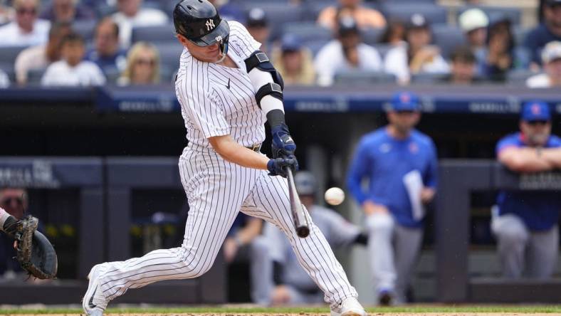 Jul 8, 2023; Bronx, New York, USA; New York Yankees designated hitter Josh Donaldson (28) hits a home run against the Chicago Cubs during the second inning at Yankee Stadium. Mandatory Credit: Gregory Fisher-USA TODAY Sports