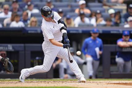 Jul 8, 2023; Bronx, New York, USA; New York Yankees designated hitter Josh Donaldson (28) hits a home run against the Chicago Cubs during the second inning at Yankee Stadium. Mandatory Credit: Gregory Fisher-USA TODAY Sports