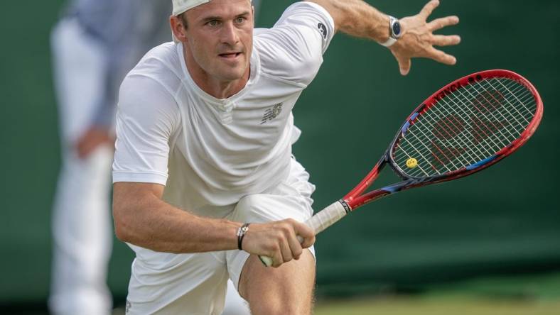 Jul 8, 2023; London, United Kingdom; Tommy Paul (USA) runs for the ball during his match against Jiri Lehecka (CZE) on day six at the All England Lawn Tennis and Croquet Club.  Mandatory Credit: Susan Mullane-USA TODAY Sports