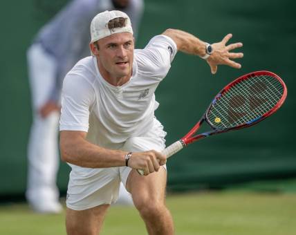 Jul 8, 2023; London, United Kingdom; Tommy Paul (USA) runs for the ball during his match against Jiri Lehecka (CZE) on day six at the All England Lawn Tennis and Croquet Club.  Mandatory Credit: Susan Mullane-USA TODAY Sports
