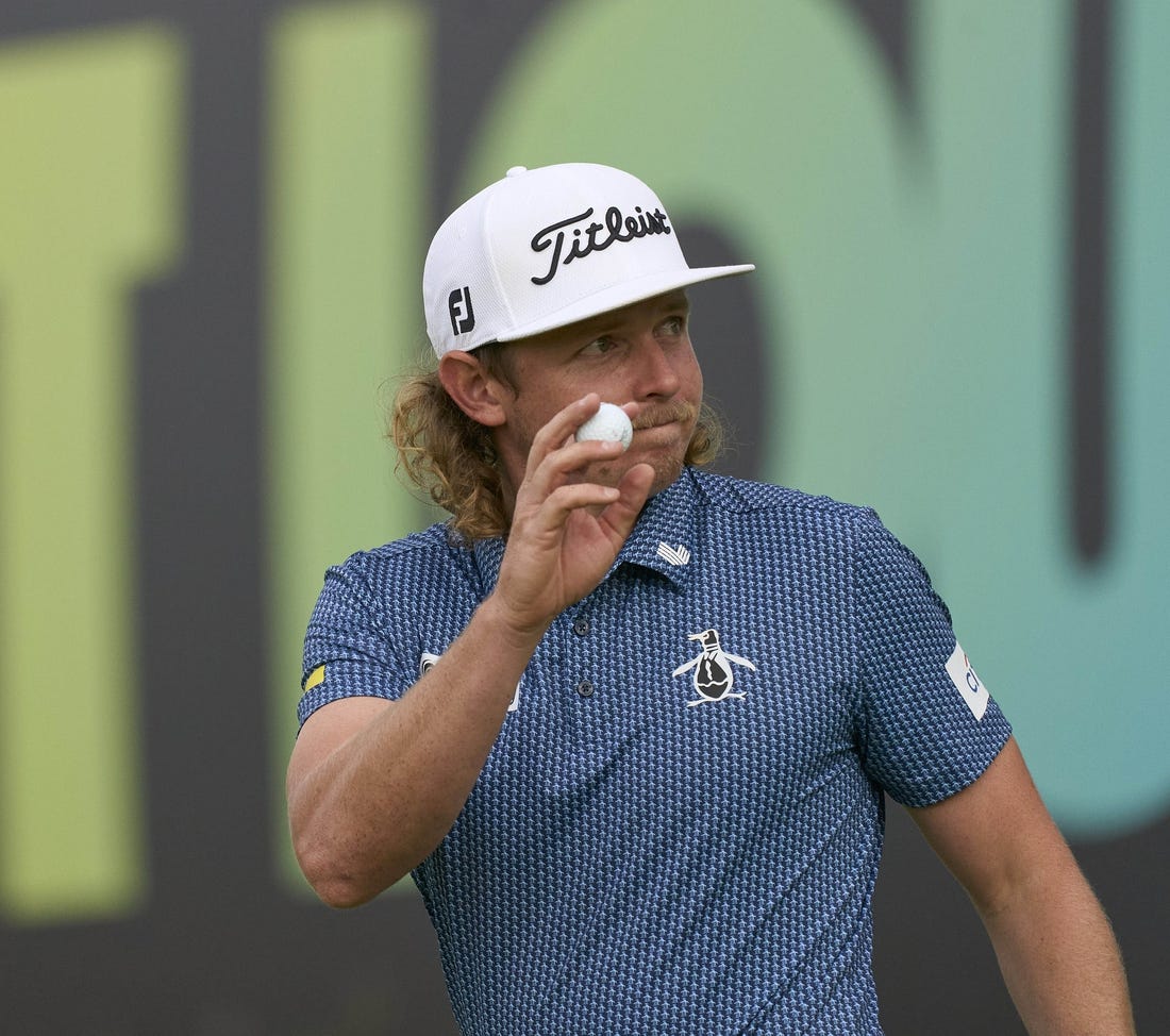 Jul 8, 2023; Hertfordshire, England, GBR; Cameron Smith (AUS) acknowledges the crowd on the 18th green during the second round of the LIV Golf London golf tournament at Centurion Club. Mandatory Credit: Peter van den Berg-USA TODAY Sports