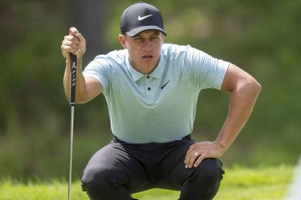 Jul 8, 2023; Silvis, Illinois, USA; Cameron Champ lines up a putt on the 9th hole during the third round of the John Deere Classic golf tournament. Mandatory Credit: Marc Lebryk-USA TODAY Sports