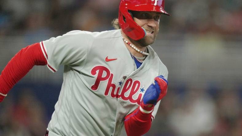 Jul 8, 2023; Miami, Florida, USA; Philadelphia Phillies designated hitter Bryce Harper (3) runs out a double in the first inning against the Miami Marlins at loanDepot Park. Mandatory Credit: Jim Rassol-USA TODAY Sports