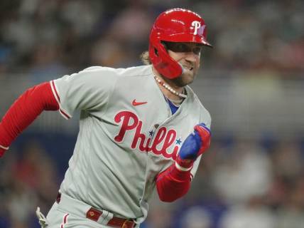 Jul 8, 2023; Miami, Florida, USA; Philadelphia Phillies designated hitter Bryce Harper (3) runs out a double in the first inning against the Miami Marlins at loanDepot Park. Mandatory Credit: Jim Rassol-USA TODAY Sports