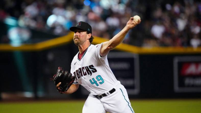 July 8, 2023; Phoenix, Ariz.; USA; Diamondbacks pitcher Tyler Gilbert (49) pitches against the Pirates during a game against the Pirates at Chase Field.