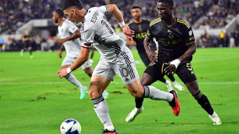 July 8, 2023; Los Angeles, California, USA; San Jose Earthquakes forward Cristian Espinoza (10) moves the ball against Los Angeles FC defender Mamadou Fall (5) during the first half at BMO Stadium. Mandatory Credit: Gary A. Vasquez-USA TODAY Sports