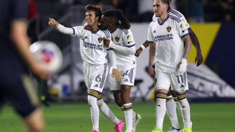 Jul 8, 2023; Carson, California, USA; Los Angeles Galaxy midfielder Riqui Puig (6) celebrates with forward Raheem Edwards (44) and midfielder Tyler Boyd (11) after scoring during the second half against the Philadelphia Union at Dignity Health Sports Park. Mandatory Credit: Jason Parkhurst-USA TODAY Sports