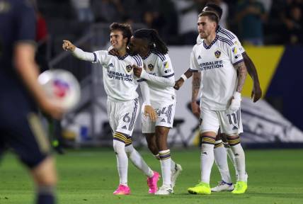 Jul 8, 2023; Carson, California, USA; Los Angeles Galaxy midfielder Riqui Puig (6) celebrates with forward Raheem Edwards (44) and midfielder Tyler Boyd (11) after scoring during the second half against the Philadelphia Union at Dignity Health Sports Park. Mandatory Credit: Jason Parkhurst-USA TODAY Sports