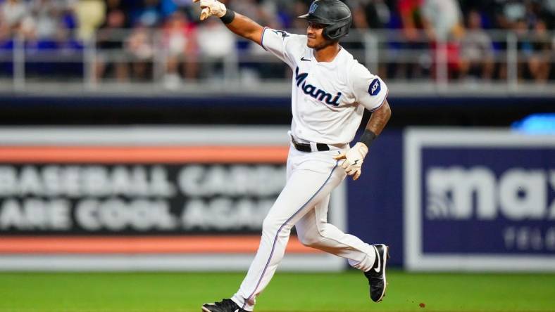 Jul 9, 2023; Miami, Florida, USA; Miami Marlins right fielder Dane Myers (54) runs the bases after hitting a home run against the Philadelphia Phillies during the third inning at loanDepot Park. Mandatory Credit: Rich Storry-USA TODAY Sports