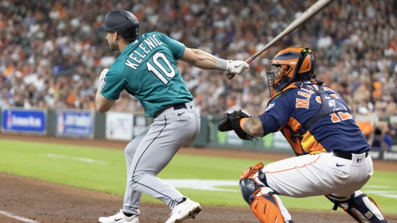 Jul 9, 2023; Houston, Texas, USA; Seattle Mariners left fielder Jarred Kelenic (10) hits a RBI double against the Houston Astros in the fourth inning at Minute Maid Park. Mandatory Credit: Thomas Shea-USA TODAY Sports