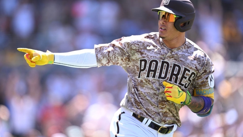 Jul 9, 2023; San Diego, California, USA; San Diego Padres third baseman Manny Machado (13) gestures toward the Padres dugout after hitting a two-run home run against the New York Mets during the fifth inning at Petco Park. Mandatory Credit: Orlando Ramirez-USA TODAY Sports