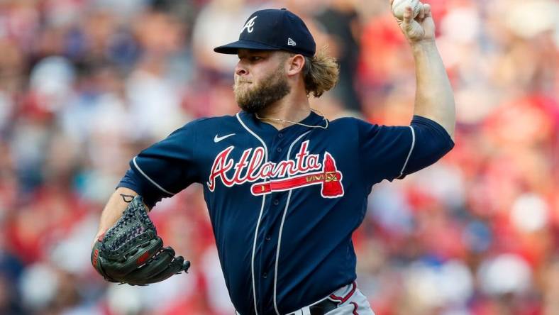 Jun 24, 2023; Cincinnati, Ohio, USA; Atlanta Braves relief pitcher A.J. Minter (33) pitches against the Cincinnati Reds in the eighth inning at Great American Ball Park. Mandatory Credit: Katie Stratman-USA TODAY Sports