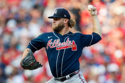 Jun 24, 2023; Cincinnati, Ohio, USA; Atlanta Braves relief pitcher A.J. Minter (33) pitches against the Cincinnati Reds in the eighth inning at Great American Ball Park. Mandatory Credit: Katie Stratman-USA TODAY Sports