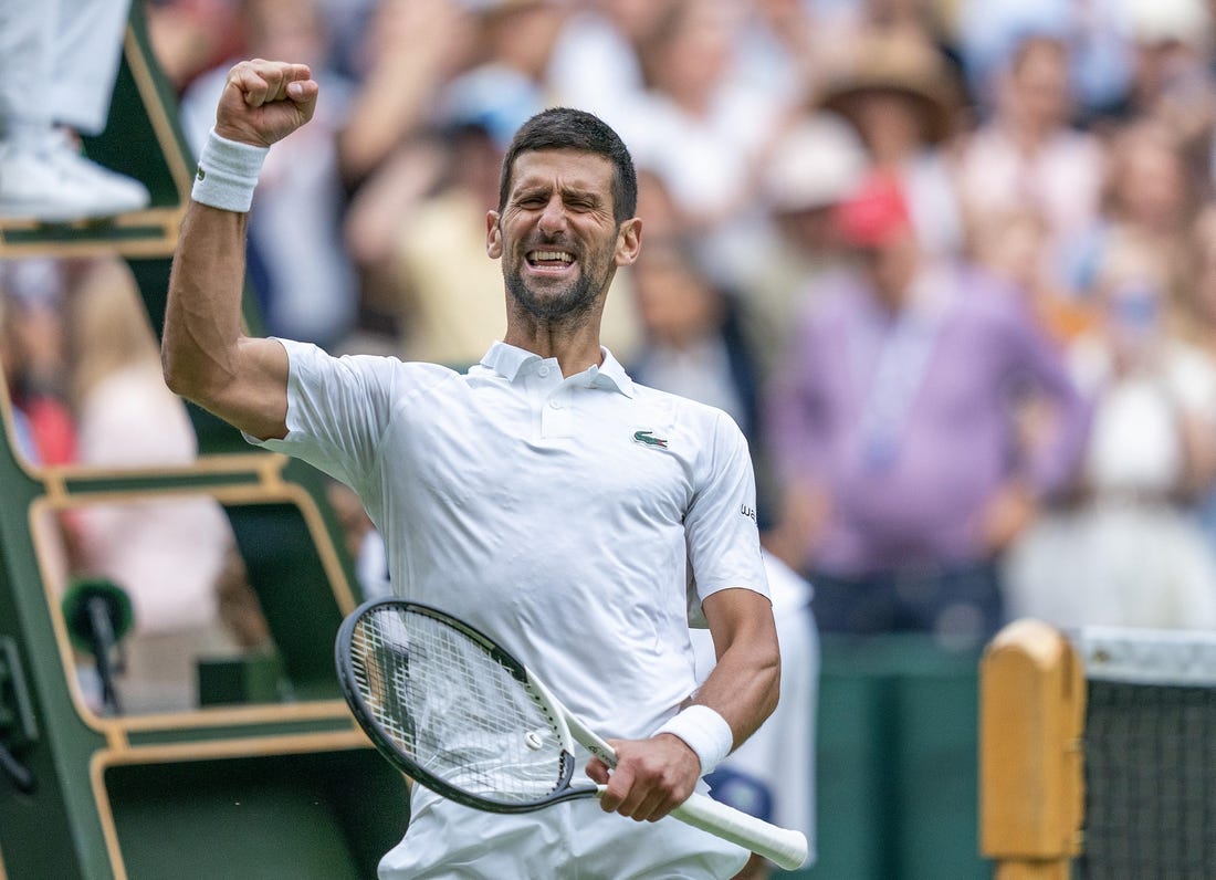 Jul 11, 2023; London, United Kingdom; Novak Djokovic (SRB) celebrates winning his match against Andrey Rublev on day nine at the All England Lawn Tennis and Croquet Club.  Mandatory Credit: Susan Mullane-USA TODAY Sports