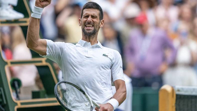 Jul 11, 2023; London, United Kingdom; Novak Djokovic (SRB) celebrates winning his match against Andrey Rublev on day nine at the All England Lawn Tennis and Croquet Club.  Mandatory Credit: Susan Mullane-USA TODAY Sports