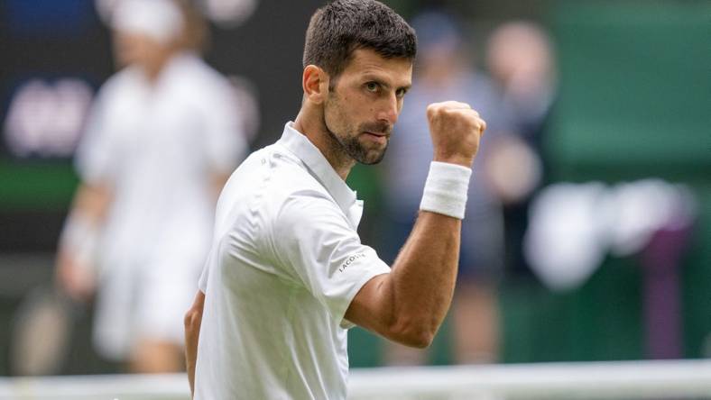 Jul 11, 2023; London, United Kingdom; Novak Djokovic (SRB) reacts to a point during his match against Andrey Rublev on day nine at the All England Lawn Tennis and Croquet Club. Mandatory Credit: Susan Mullane-USA TODAY Sports