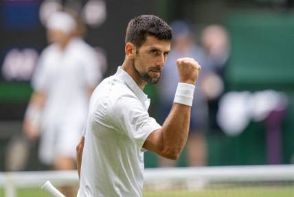 Jul 11, 2023; London, United Kingdom; Novak Djokovic (SRB) reacts to a point during his match against Andrey Rublev on day nine at the All England Lawn Tennis and Croquet Club. Mandatory Credit: Susan Mullane-USA TODAY Sports