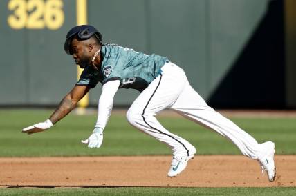 Jul 11, 2023; Seattle, Washington, USA; American League left fielder Randy Arozarena of the Tampa Bay Rays (56) attempts to steal second base during the first inning of the 2023 MLB All Star Game at T-Mobile Park. Mandatory Credit: Joe Nicholson-USA TODAY Sports