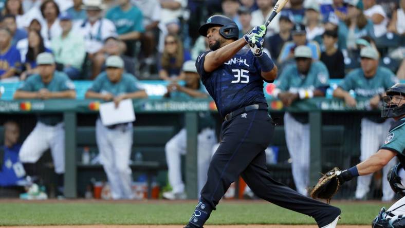 Jul 11, 2023; Seattle, Washington, USA; National League catcher Elias DIaz of the Colorado Rockies (35) hits a two-run home run against the American League during the eighth inning of the 2023 MLB All Star Game at T-Mobile Park. Mandatory Credit: Joe Nicholson-USA TODAY Sports