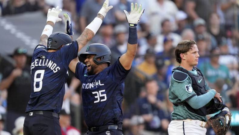 Jul 11, 2023; Seattle, Washington, USA; National League catcher  Elias Diaz  of the Colorado Rockies (35) reacts after hitting a two run home run against the American League during the eighth inning at T-Mobile Park. Mandatory Credit: Stephen Brashear-USA TODAY Sports