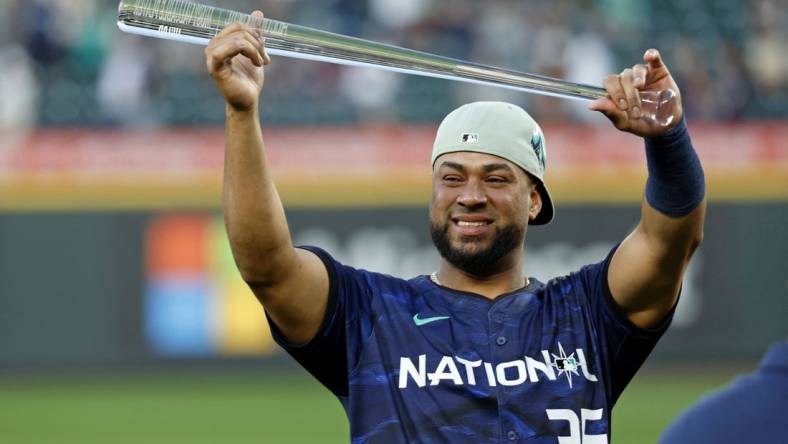 Jul 11, 2023; Seattle, Washington, USA; National League catcher Elias DIaz of the Colorado Rockies (35) holds up the MVP trophy after winning the 2023 MLB All Star Game at T-Mobile Park. Mandatory Credit: Joe Nicholson-USA TODAY Sports