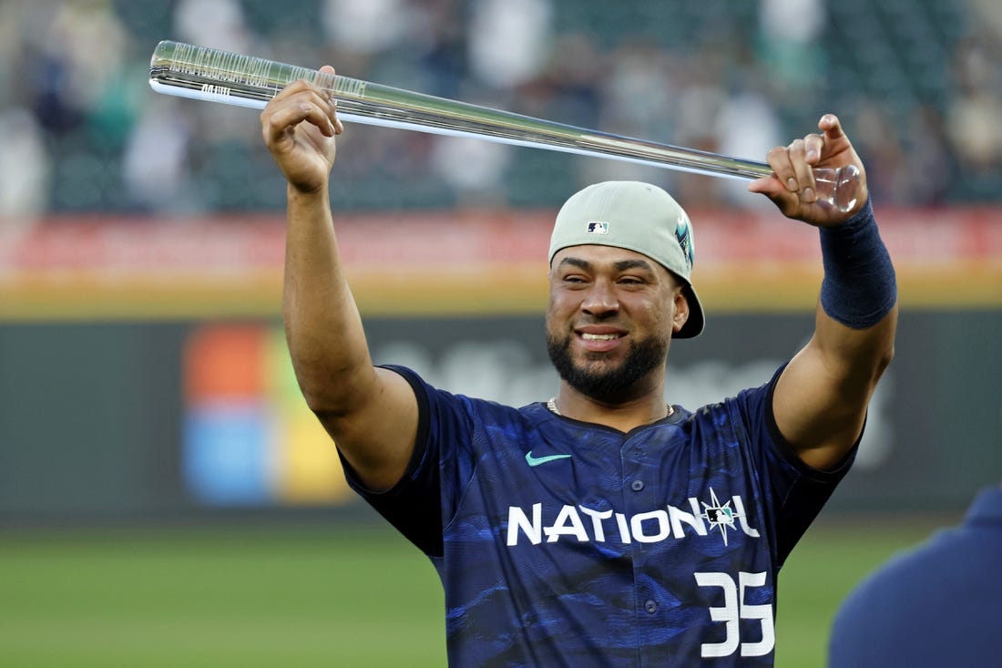 Jul 11, 2023; Seattle, Washington, USA; National League catcher Elias DIaz of the Colorado Rockies (35) holds up the MVP trophy after winning the 2023 MLB All Star Game at T-Mobile Park. Mandatory Credit: Joe Nicholson-USA TODAY Sports