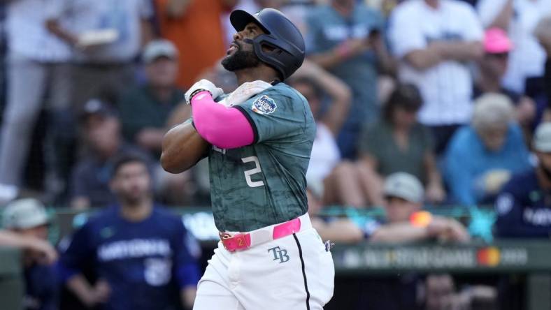 Jul 11, 2023; Seattle, Washington, USA; American League first baseman  Yandy Diaz  of the Tampa Bay Rays (2) reacts after hitting a home run during the second inning at T-Mobile Park. Mandatory Credit: Stephen Brashear-USA TODAY Sports